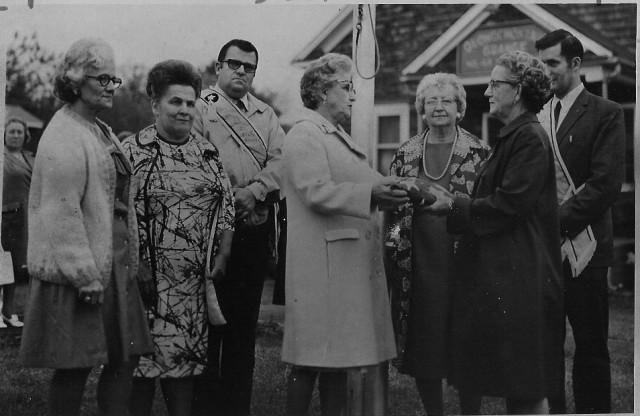 From the Archives: In this shot from the Westerly Sun on 6/9/72, a new flagpole is dedicated in front of the Qunochontaug Grange.  The Grange is a familiar sight to DCFD members, as it was acquired when the Grange sold it to the District in 1990.